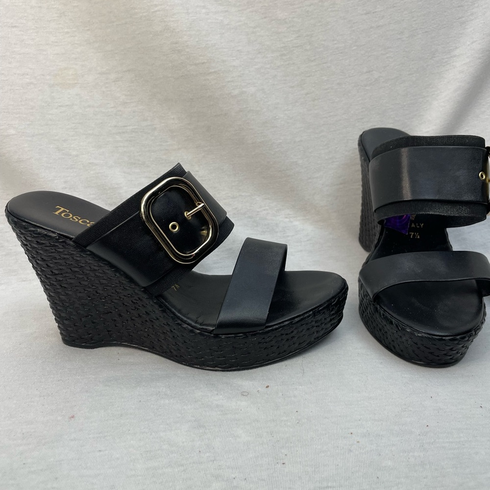 Black, platform slip in wedge with side gold buckle. Size 7